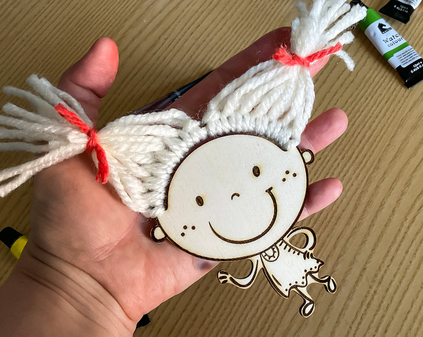Laser cut figures of kids for adding yarn hair, DIY children faces craft for glowforge